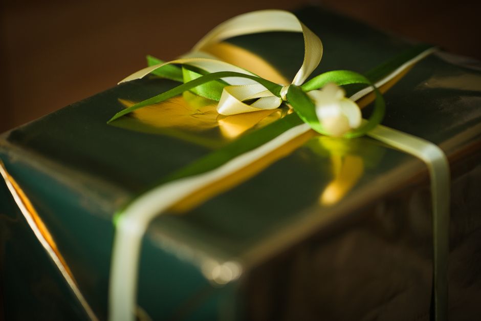 A beautifully wrapped gift with ribbon, the joyful reveal that captures the emotional side of branding